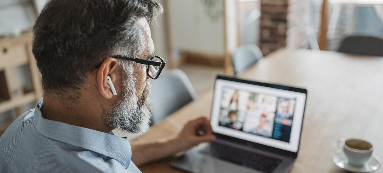 Man working on virtual meeting