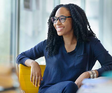 Business woman sitting at desk in office