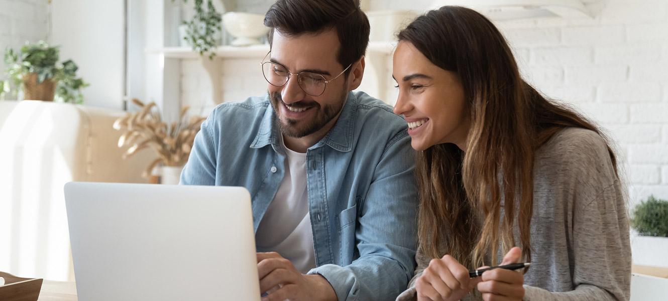 Couple looking at laptop computer