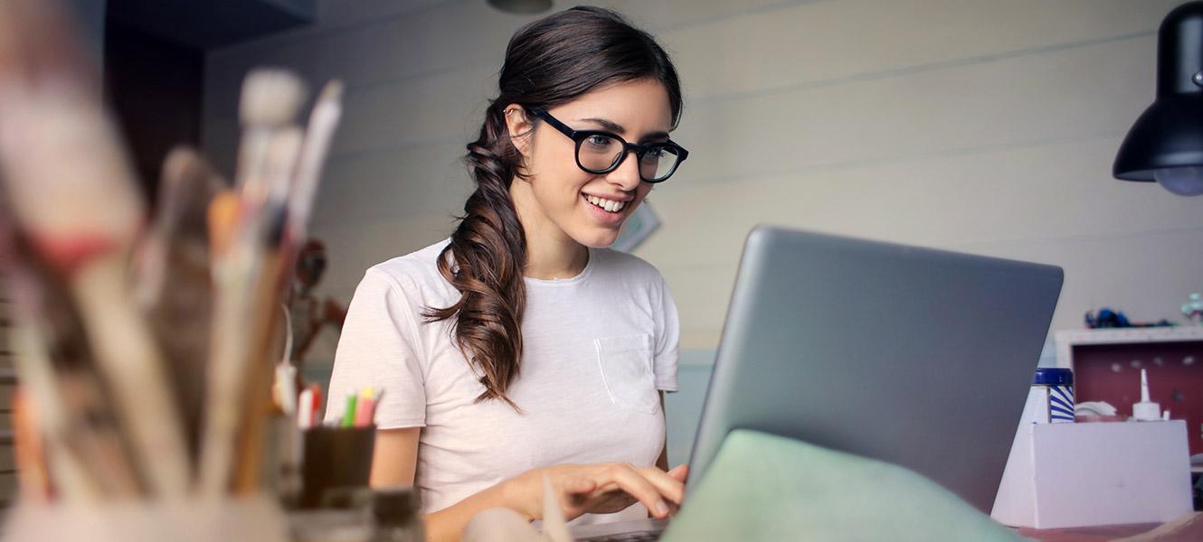 Woman working on computer in home office